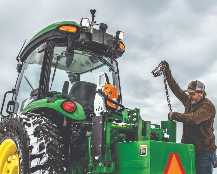 john deere tractor in snow