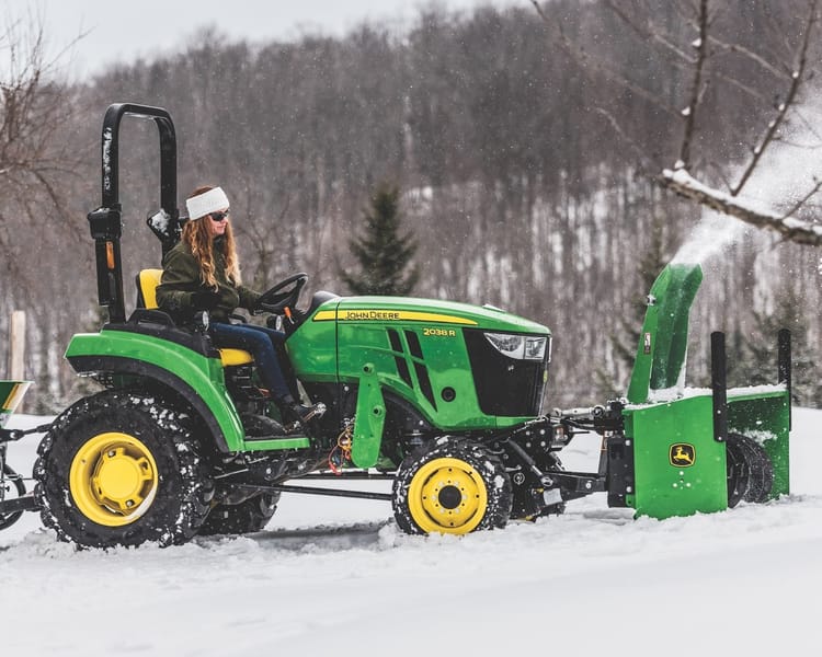 john deere compact tractor in snow